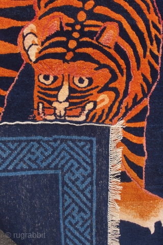 Period: 1920

Set against a dark indigo background, this tiger stands to attract attention. This powerful tiger is just turning around, ready to scare of any evil whilst maintaining a friendly attitude towards  ...