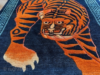 Period: 1920

Set against a dark indigo background, this tiger stands to attract attention. This powerful tiger is just turning around, ready to scare of any evil whilst maintaining a friendly attitude towards  ...