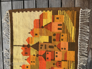 Polish artist rug from the 1970s. Wool on This vintage Polish folklore kilim wall hanging beautifully captures a traditional village scene with bold color blocks and stylized forms. In warm tones of  ...