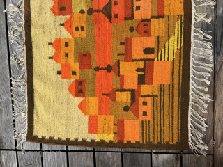 Polish artist rug from the 1970s. Wool on This vintage Polish folklore kilim wall hanging beautifully captures a traditional village scene with bold color blocks and stylized forms. In warm tones of  ...