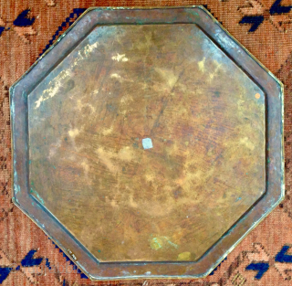 This original antique Persian/Middle Eastern Octagonal 19th c. brass tray features exquisite hand engravings with eight Arabic calligraphy cartouches.
The intricate design and the beauty of the engravings make it a unique piece  ...