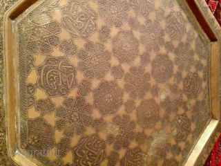 This original antique Persian/Middle Eastern Octagonal 19th c. brass tray features exquisite hand engravings with eight Arabic calligraphy cartouches.
The intricate design and the beauty of the engravings make it a unique piece  ...