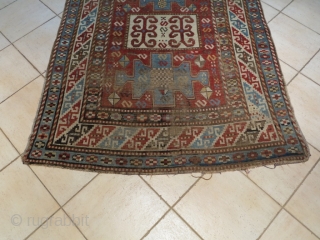 Caucasian Kazak Karachof,  in some part of the field but shining. cm 235x129. Good rug to restore or to collect with a cheap price.        