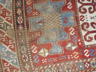 Caucasian Kazak Karachof,  in some part of the field but shining. cm 235x129. Good rug to restore or to collect with a cheap price.        