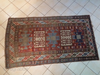 Caucasian Kazak Karachof,  in some part of the field but shining. cm 235x129. Good rug to restore or to collect with a cheap price.        