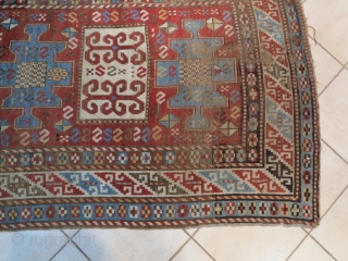 Caucasian Kazak Karachof,  in some part of the field but shining. cm 235x129. Good rug to restore or to collect with a cheap price.        