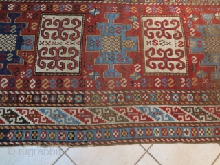 Caucasian Kazak Karachof,  in some part of the field but shining. cm 235x129. Good rug to restore or to collect with a cheap price.        