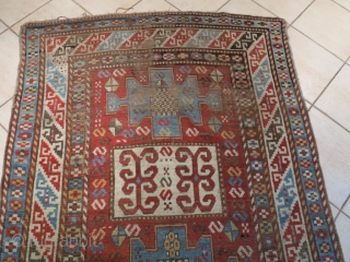 Caucasian Kazak Karachof,  in some part of the field but shining. cm 235x129. Good rug to restore or to collect with a cheap price.        