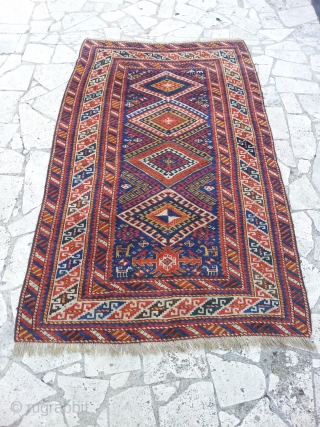 KAZAK cm 200x125  6,5"X4" ca. 1920 ca.

very good condition, in pile. Nice motifs on the bottom head with little animals and a different motif under the three  medallions, probably a  ...