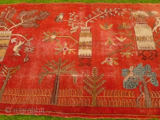 Charming 1930's Khotan 'landscape' rug decorated with trees, vases and birds - convincing enough to make a cat curious (see image 5). Condition, some areas of wear and old moth damage but  ...