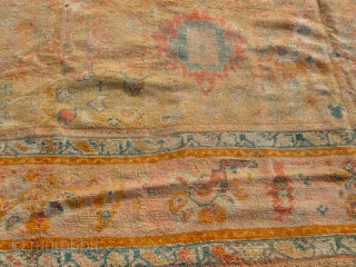 Lovely soft wool and colours, on this faded old west Anatolian Ghordes/Ushak type carpet. Condition, areas of wear but has been cleaned and ends stopped so ready to use. Size: 15'.4" x  ...