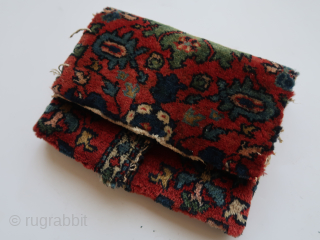 Folded / doubled fragmented bag.  Folded  ca : 26 cm x 20 cm .Floral motives ,different colors .   Persian ?         