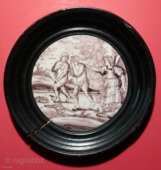 Rotterdam, 18th.century.  Two original mangan glazed Dutch tiles.   Depicting the Flood and the Exile from Eden.   Diameter including the outer wooden frame,  ca. 16 cm.   ...