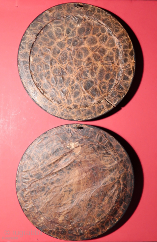 Rotterdam, 18th.century.  Two original mangan glazed Dutch tiles.   Depicting the Flood and the Exile from Eden.   Diameter including the outer wooden frame,  ca. 16 cm.   ...