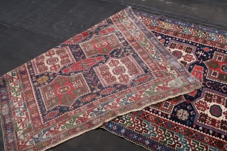  Shirwan / Shirvan .( Kuba Shahnazarli Rug ) In the dark blue field ,surrounded by the main eagle beaked borders , twelve cartouche medallions have been aligned vertically in two rows  ...
