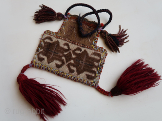 Central Asian ? / Anatolian ?  small fragmented bag. ca : 21 cm.x 19 cm. ( execpt tassels.) Wool, cotton, fibres, hole. (And some nuts.)       