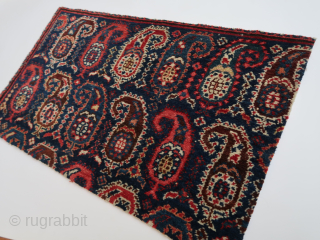 Frament, several large boteh s on a dark blue field.  Ca : 79 cm x 45 cm. Bidjar ? / Kirman ? .         