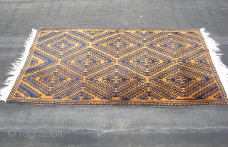 Mahswani ,old ,ca, 180 cm. x ca. 100 cm.   Wool on wool and some goathair.   A rich blue on a golden brown ( abrash ) honey field. Top  ...