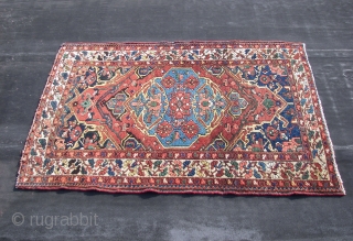 Bachtiar . Old  . ca. 195 cm. x 136 cm.  Wool on cotton.  5 cm. From top and bottom guard border missing.  Backside stitched with cotton band.   ...