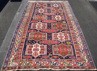 Shirwan / Shirvan .In the dark blue field ,surrounded by the main eagle beaked borders , twelve cartouche medallions have been aligned vertically in two rows of six each . Separated horizontally  ...
