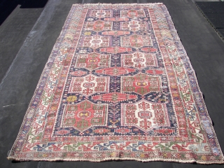 Shirwan / Shirvan .In the dark blue field ,surrounded by the main eagle beaked borders , twelve cartouche medallions have been aligned vertically in two rows of six each . Separated horizontally  ...