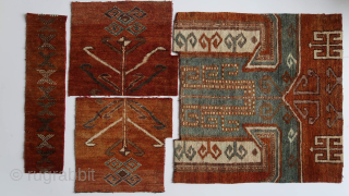 Several fragments, wool on wool, red wefts, depicting various caucasian motifs , the main one ca ; 55 x 55 cm. the rest smaller. Turkmen ? Moroccan ? Afghan ? Caucasian ?  ...