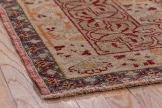 Oushak Carpet

9.0 x 13.5
2.74 x 4.11

The rather worn madder red open field is nearly covered by an oversize double spadiform  ivory medallion with internal red arabesque outlining which is repeated in  ...