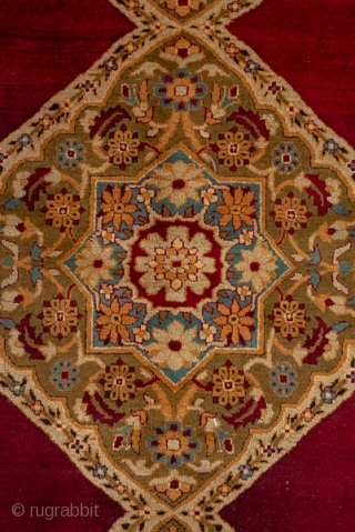 Amritsar Square Carpet

12.2 x 12.4
3.71 x 3.77
The deep wine brown semi-open field shows a pole medallion of three conjoint lozenges with matching side triangle fillers. Giant and lesser botehs  decorate the  ...