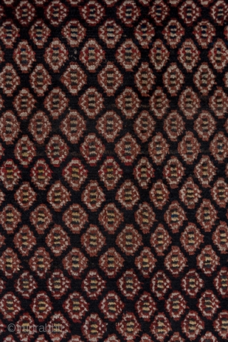 Malayer Runner

3.1 x 12.6
0.94 x 3.84

The  abrashed charcoal field features a close seme of tiny ovals within an ivory triple flower border in the Turkish manner and flanking diagonal colour-striped minors.  ...