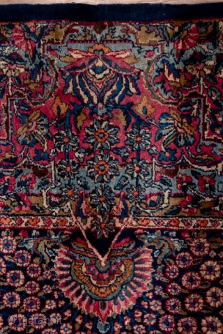 Kerman Carpet

8.10 x 17.0 
2.46 x 5.28
This top condition 1930's SE Persian urban carpet has a dark blue field covered with a fantgasy of palmettes radiating peacock  tails of floral sprays,  ...