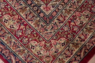 Kerman Carpet

9.0 by 12.3
2.74 x 3.74

The crisp cochineal red field displays a giant, lobed ivory medallion with dark blue interior spadiform palmettes. The ivory corners feature split navy arabesques and the main  ...