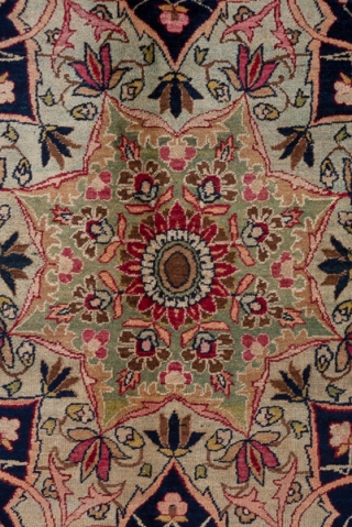 Kerman Carpet

9.0 by 12.3
2.74 x 3.74

The crisp cochineal red field displays a giant, lobed ivory medallion with dark blue interior spadiform palmettes. The ivory corners feature split navy arabesques and the main  ...