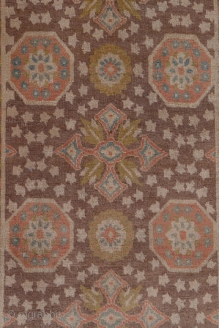 Tabriz runner

2.8 x 15.0
0.85 x 4.57

This NW Persian city runner displays an unusual repeating pattern of rust octagons and  leafy cruciforms on a  warm red-brown ground sprinkled with ivory   ...