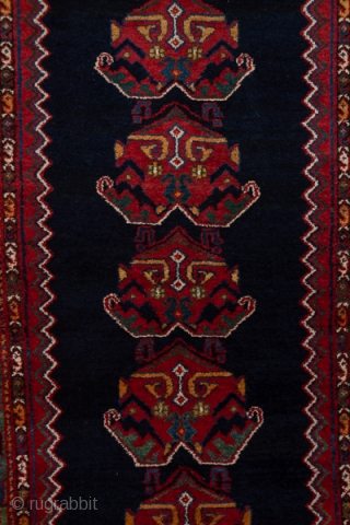 Malayer Runner

3.3 x 16.10
1.00 x 4.90

This as new west Persian runner displays a zig-zag edged navy otherwise plain subfield with 19 leafy palmettes, on a red ground.  The green main border  ...