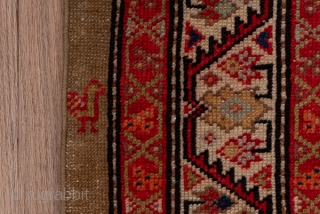 Hamadan Runner

3.6 by 17.0
1.09 x 5.18

Three offset columns of disjoint red roses  and other flowers, along with a few tiny birds, decorate the old ivory field of this rustic runner from  ...