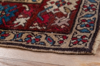 Karabagh Runner

3.1 by 14.9

The wine red main border displays ac colourful "crab" pattern and surrounds the rather worn   khaki field with its polychrome, elaborate Herati design.  This attractive south  ...