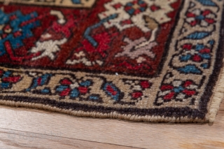Karabagh Runner

3.1 by 14.9

The wine red main border displays ac colourful "crab" pattern and surrounds the rather worn   khaki field with its polychrome, elaborate Herati design.  This attractive south  ...