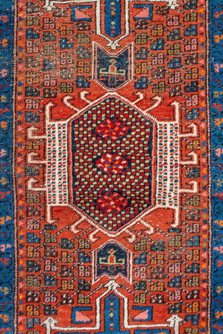 Antique Persian Heriz Runner, circa 1910. Bold geometric medallions in deep red and indigo with ivory accents, framed by a classic angular Heriz border. Strong village weave, ideal for a long hallway  ...