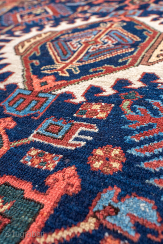 Antique Persian Karaje Rug, circa 1910. Featuring bold geometric medallions on a deep indigo field with red and ivory accents, framed by a classic angular border. Strong village character with crisp drawing ...