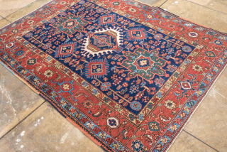 Antique Persian Karaje Rug, circa 1910. Featuring bold geometric medallions on a deep indigo field with red and ivory accents, framed by a classic angular border. Strong village character with crisp drawing ...