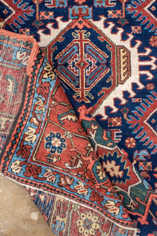 Antique Persian Karaje Rug, circa 1910. Featuring bold geometric medallions on a deep indigo field with red and ivory accents, framed by a classic angular border. Strong village character with crisp drawing ...