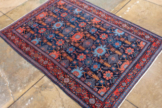 Antique Persian Senneh Rug, circa 1900. Featuring an intricate allover Herati design on a deep indigo field with soft coral and ivory accents, framed by a finely detailed border. Tightly woven with  ...