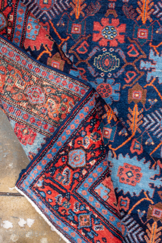 Antique Persian Senneh Rug, circa 1900. Featuring an intricate allover Herati design on a deep indigo field with soft coral and ivory accents, framed by a finely detailed border. Tightly woven with  ...