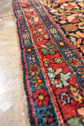 Antique Persian Bidjar Rug, circa 1910. Featuring a dense allover floral design on a dark ground with rich red and ivory accents, framed by a classic Herati border. Exceptionally sturdy weave with  ...