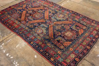 Antique Persian Bidjar Rug, circa 1900. Featuring bold geometric medallions on a deep indigo field with rich red and ivory accents, framed by a classic floral border. Dense, durable weave with strong  ...