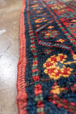 Antique Persian Bidjar Rug, circa 1900. Featuring bold geometric medallions on a deep indigo field with rich red and ivory accents, framed by a classic floral border. Dense, durable weave with strong  ...