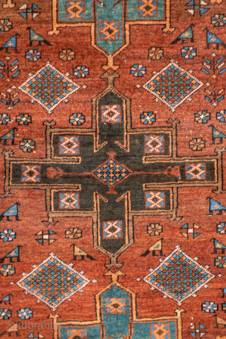 Antique Persian Heriz Rug, circa 1910. Featuring bold geometric medallions on a warm rust field with turquoise and ivory accents, framed by a classic angular Heriz border. Strong village weaving with lively  ...