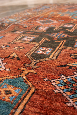 Antique Persian Heriz Rug, circa 1910. Featuring bold geometric medallions on a warm rust field with turquoise and ivory accents, framed by a classic angular Heriz border. Strong village weaving with lively  ...