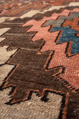 Antique Persian Serapi Carpet, circa 1900. Featuring a bold geometric medallion on a warm rust field with soft blue and ivory accents, framed by a classic Heriz-style border. Strong Northwest Persian design  ...