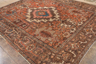 Antique Persian Serapi Carpet, circa 1900. Featuring a bold geometric medallion on a warm rust field with soft blue and ivory accents, framed by a classic Heriz-style border. Strong Northwest Persian design  ...
